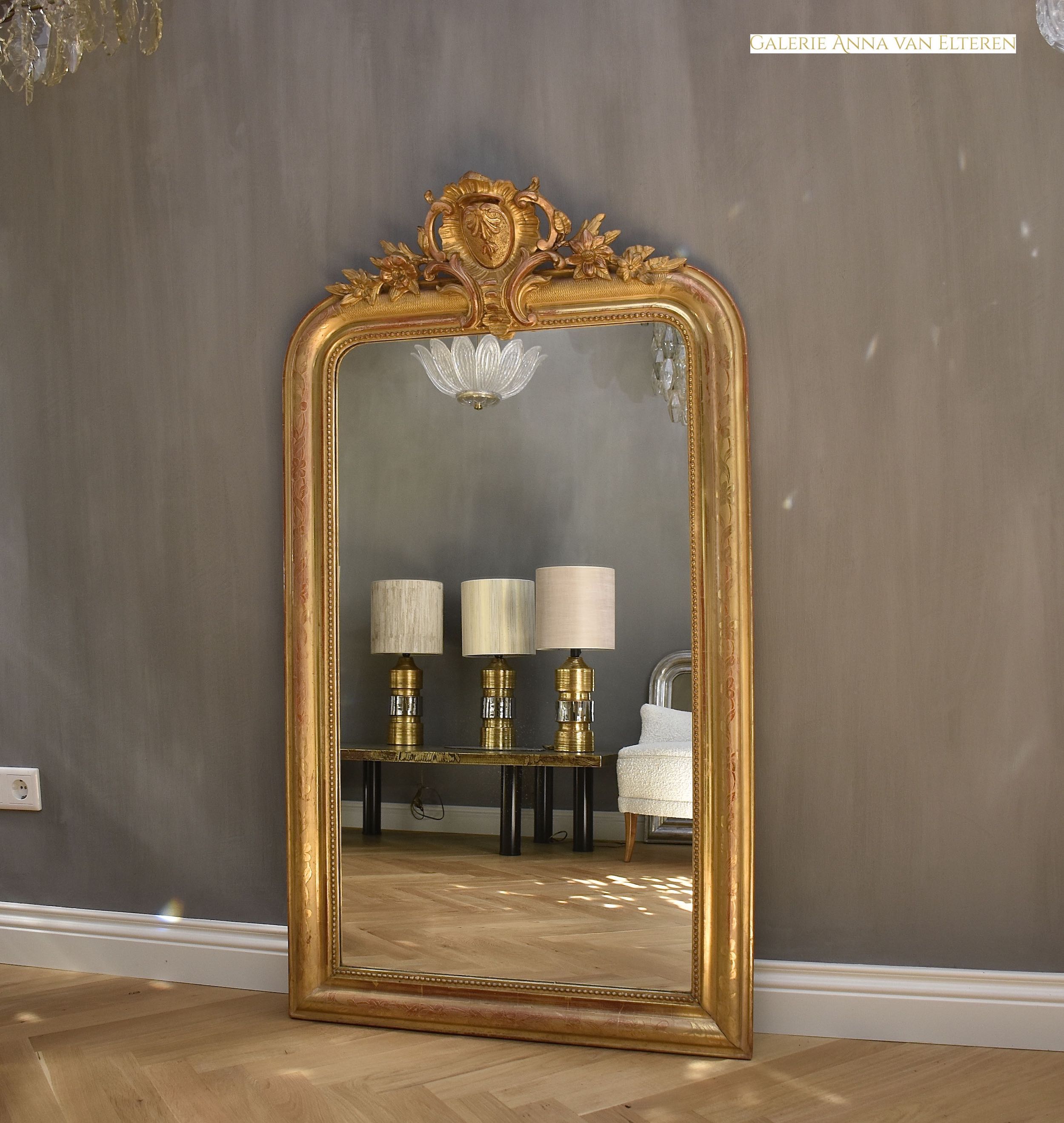 19th c. French gold leaf mirror with a crest