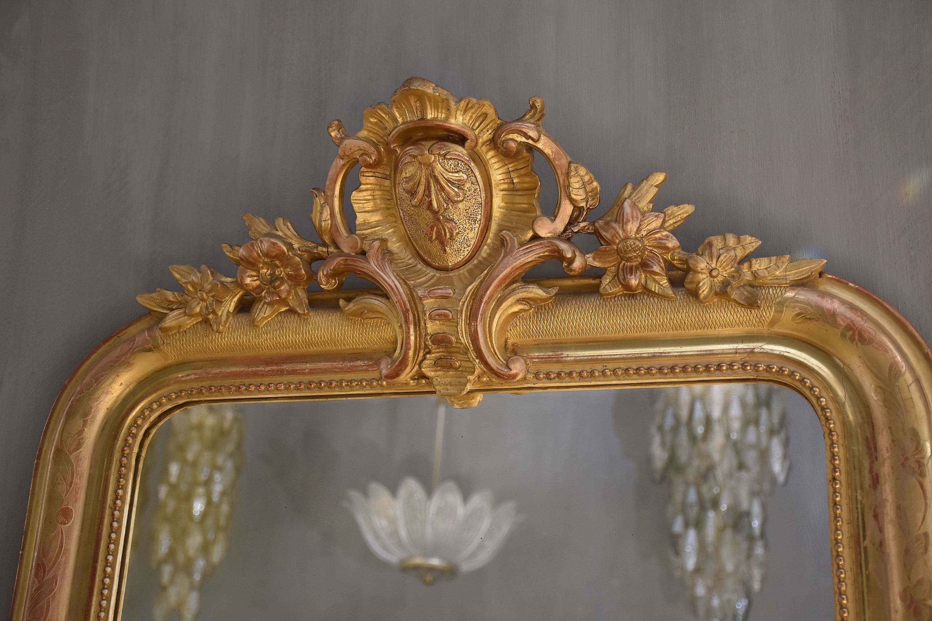 19th c. French gold leaf mirror with a crest