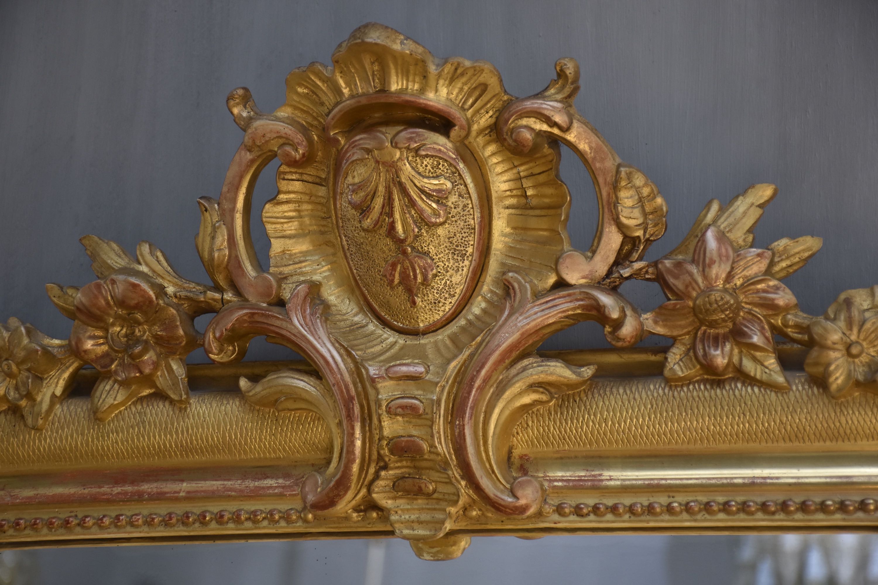 19th c. French gold leaf mirror with a crest