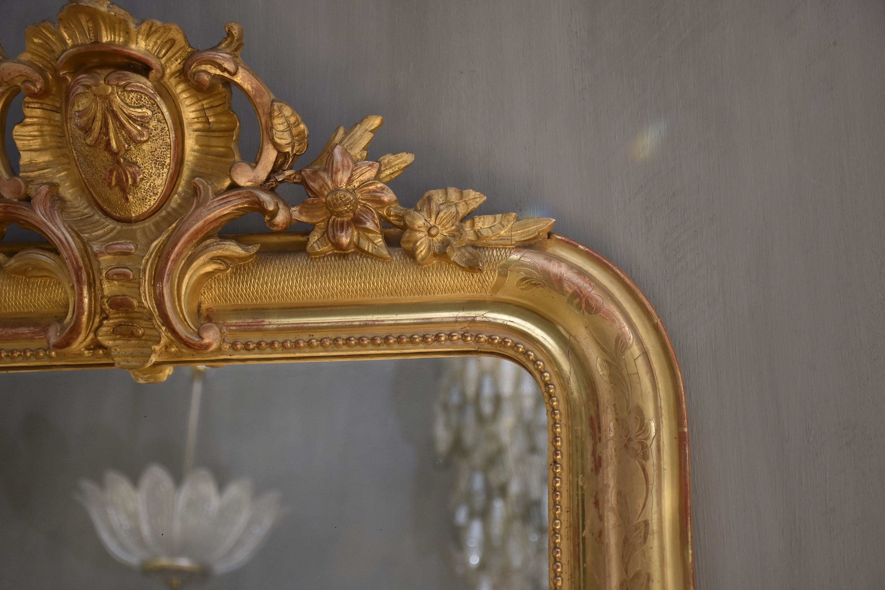 19th c. French gold leaf mirror with a crest