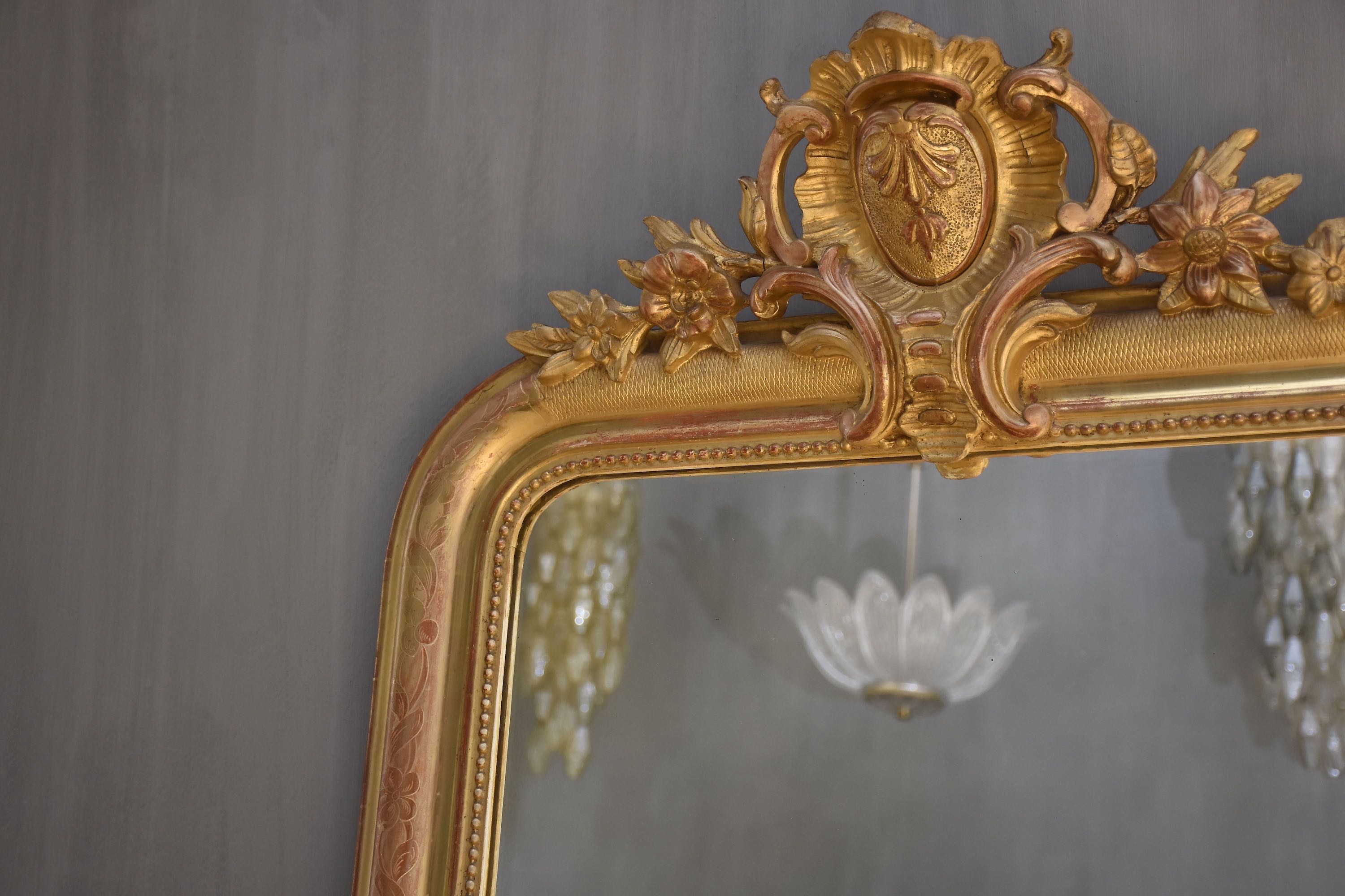 19th c. French gold leaf mirror with a crest