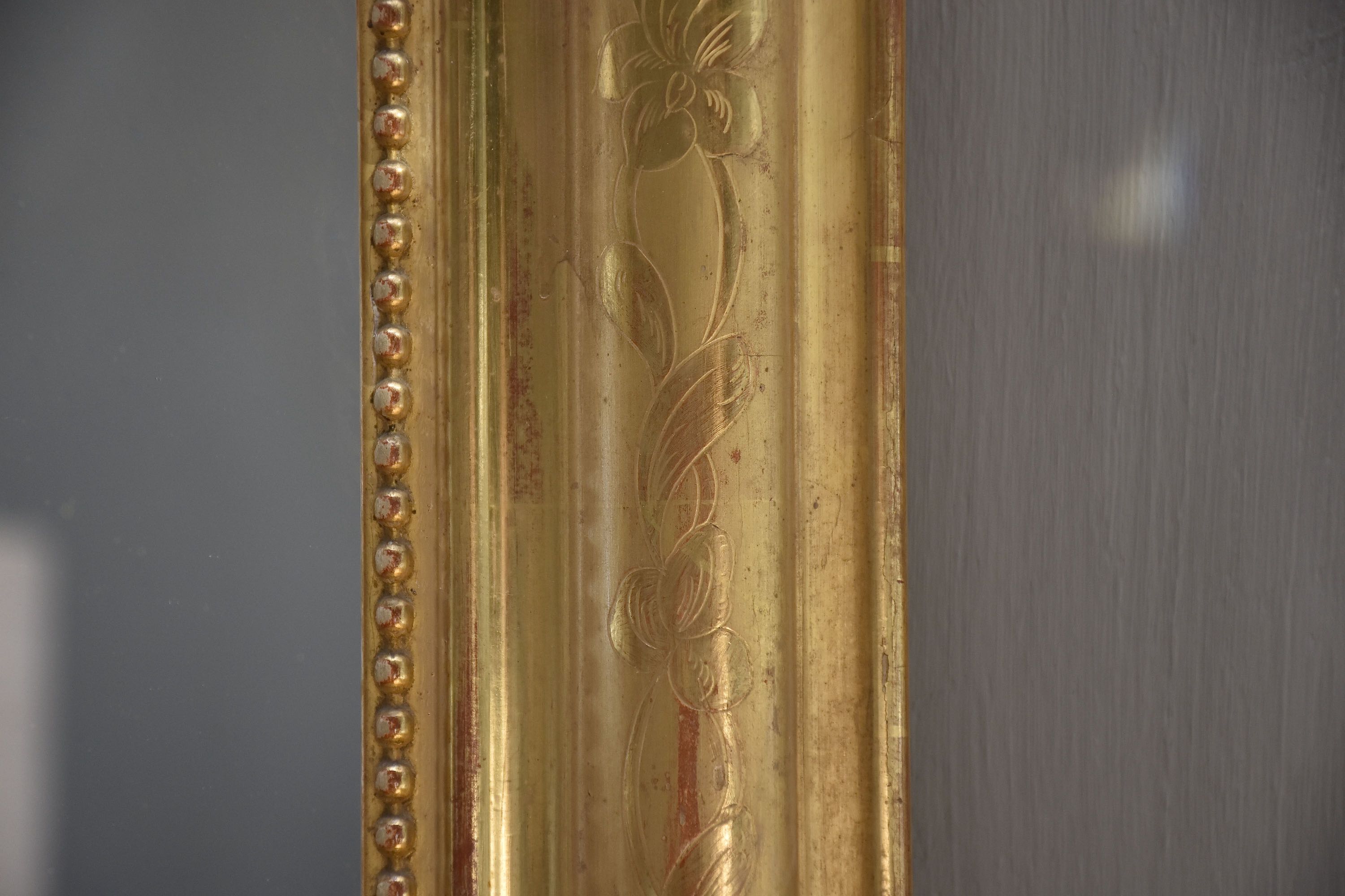 19th c. French gold leaf mirror with a crest