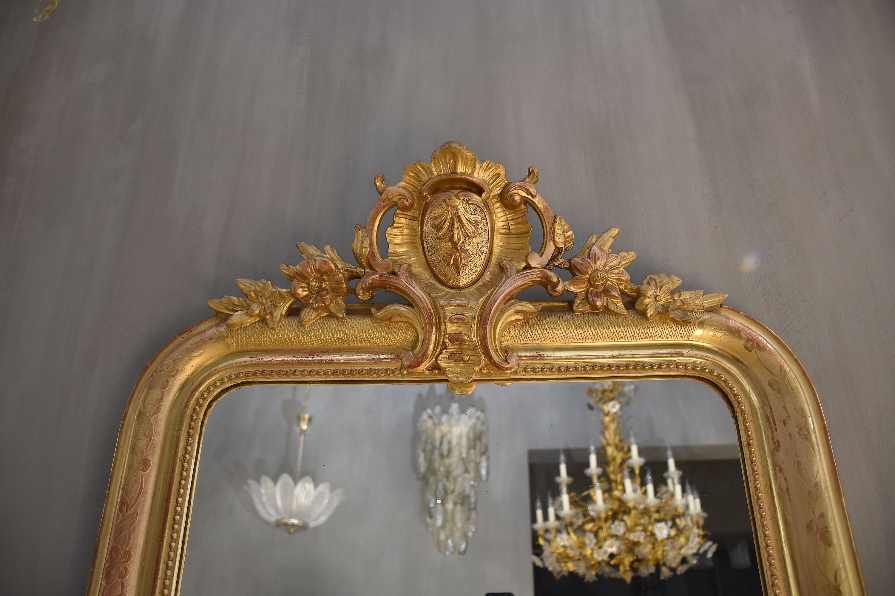 19th c. French gold leaf mirror with a crest