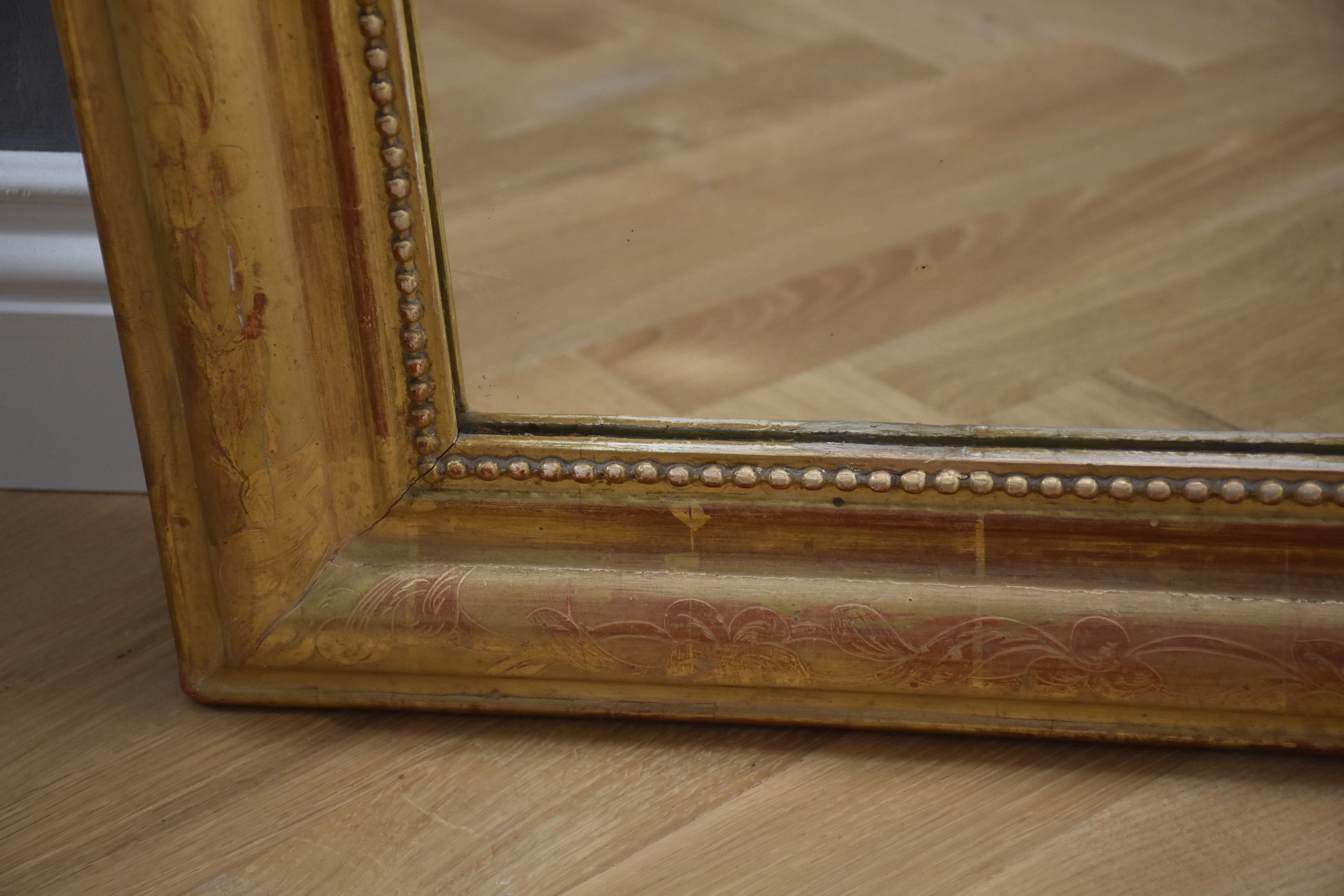 19th c. French gold leaf mirror with a crest