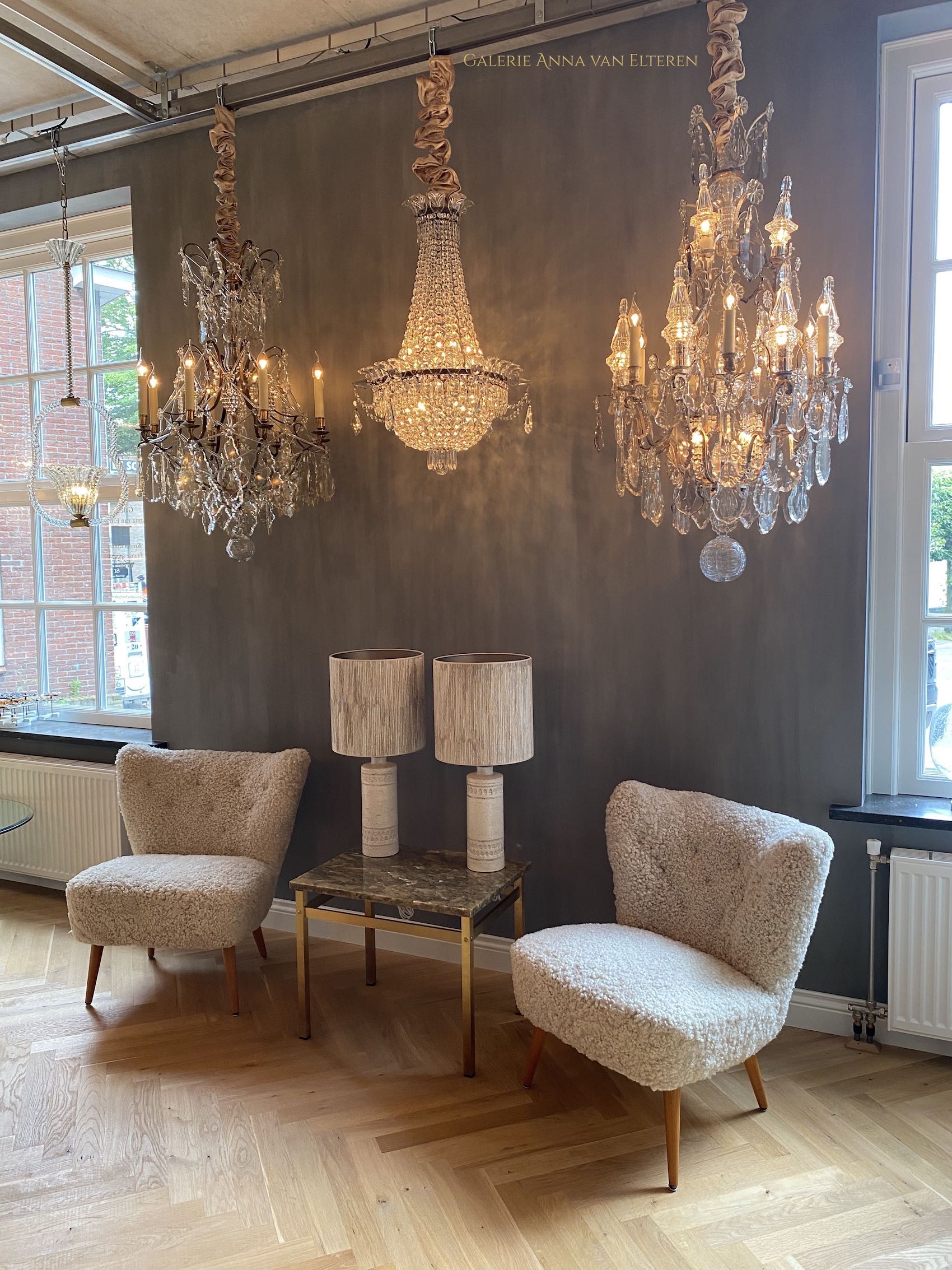 A pair of Swedish coctail or lounge armchairs in sheepskin