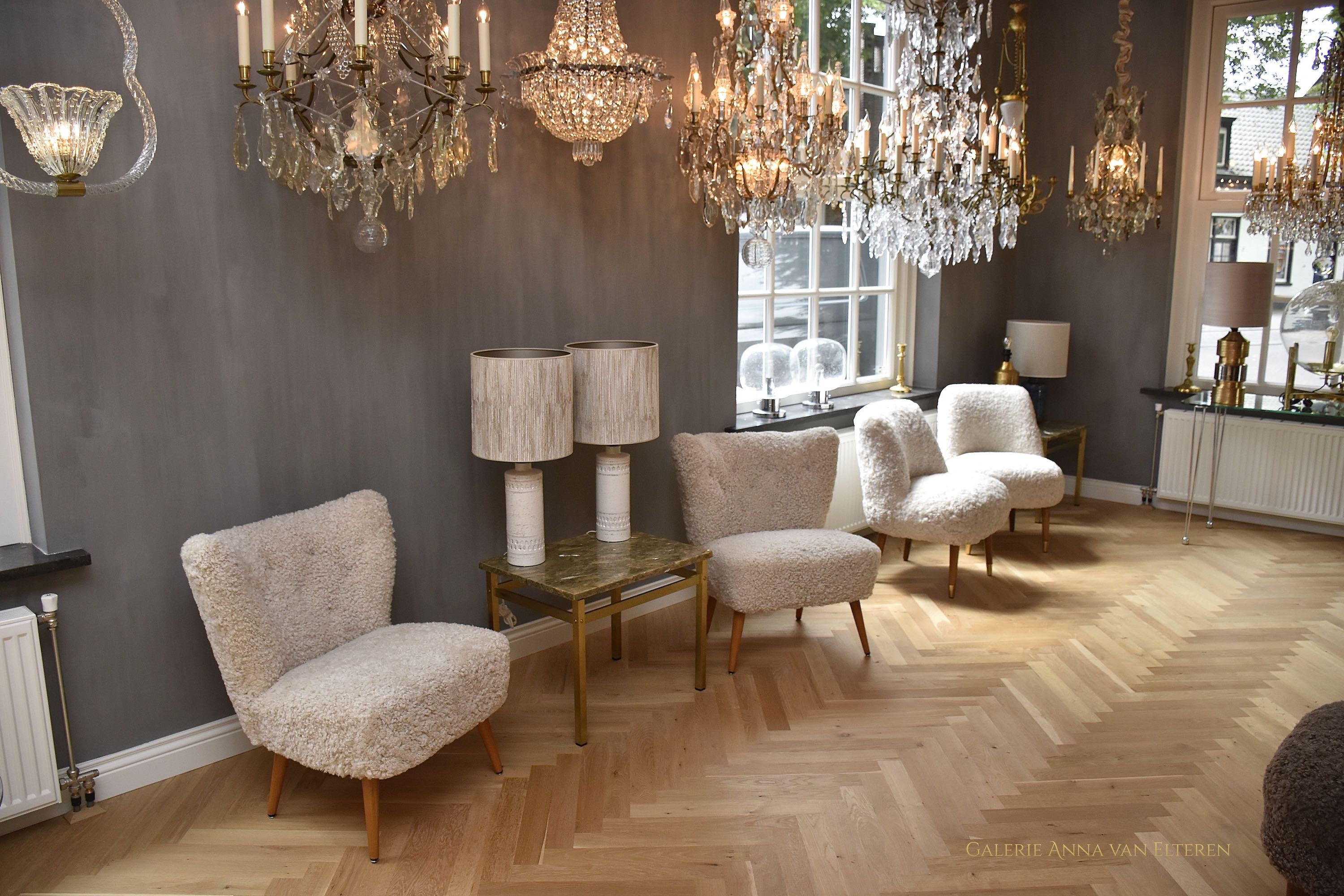 A pair of Swedish coctail or lounge armchairs in sheepskin