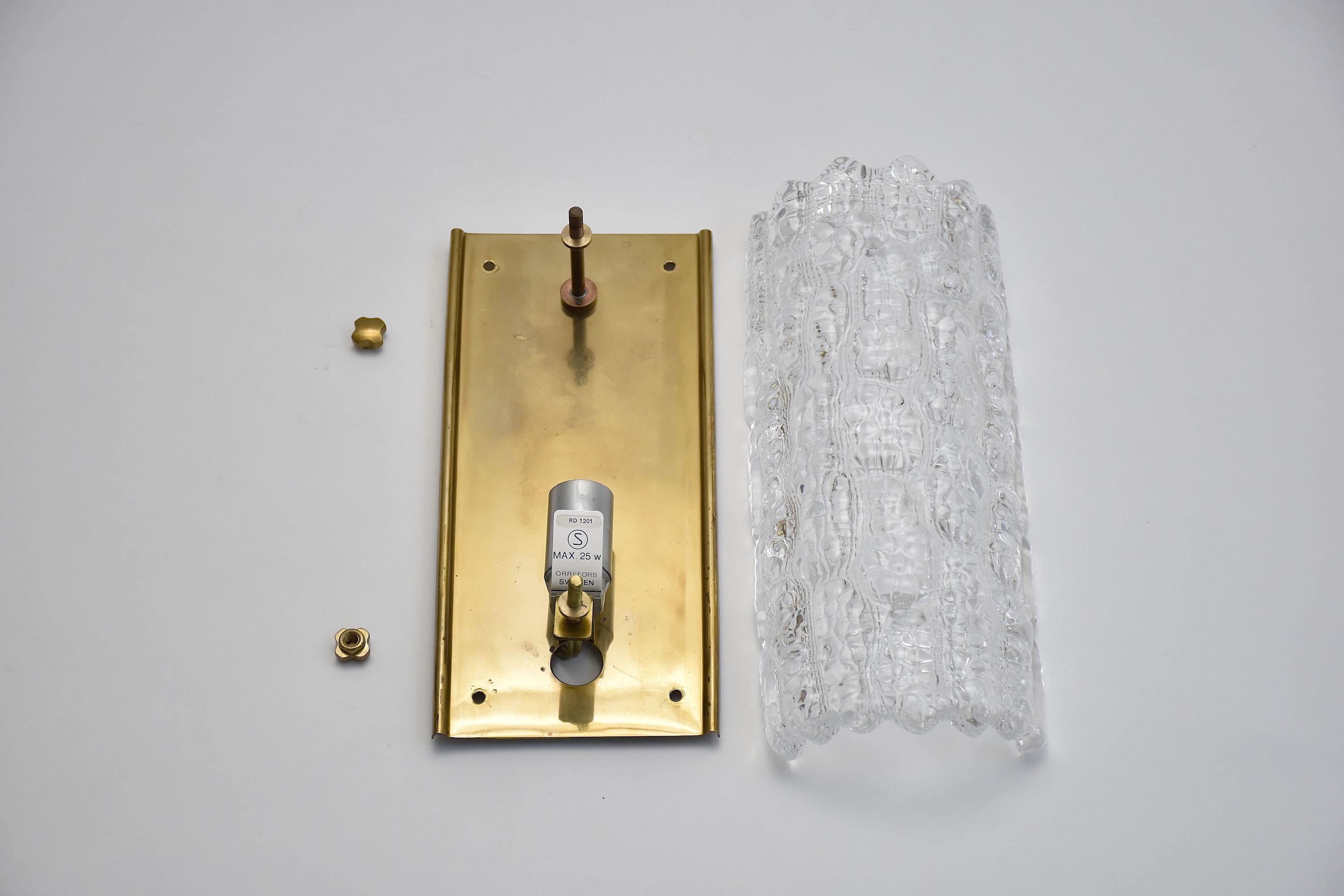 A pair of mid-century glass and brass wall lights by Carl Fagerlund